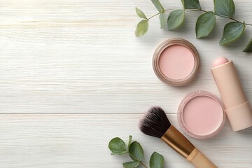 Flat Lay of Pink Blush and Makeup Brushes on White Wooden Surface