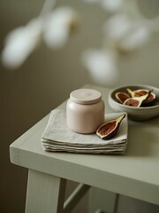 Pink jar and figs on a light green table fruit food