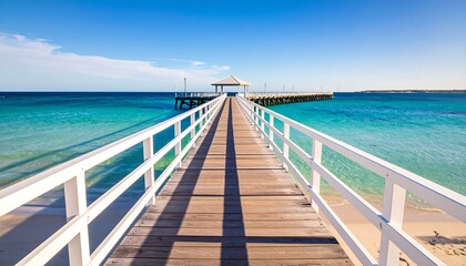 Fototapeta premium White wooden pier leading to turquoise water