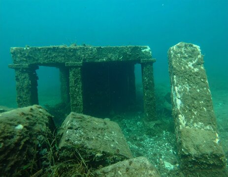 Submerged Ancient City Ruins Beneath Crystal Clear Ocean Waters