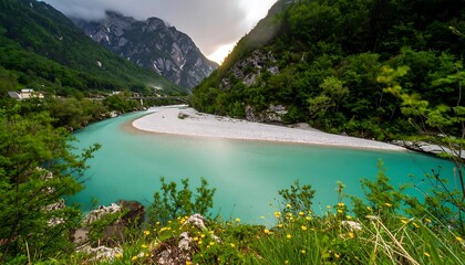 Turquoise river winding through lush mountains