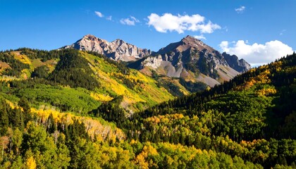 Scenic Colorado mountain range landscape with autumn foliage and blue sky