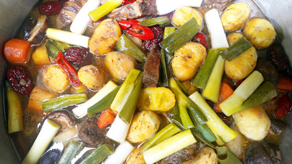 Traditional Korean Braised Beef Short Ribs with Chestnuts, Green Onions, Jujubes, and Red Chili...