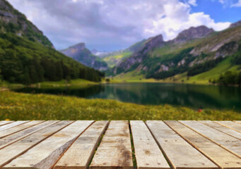 Wooden table top on blur stream water and forest natural background in lagoon or river.For montage product display or design key visual layout.view of copy space.