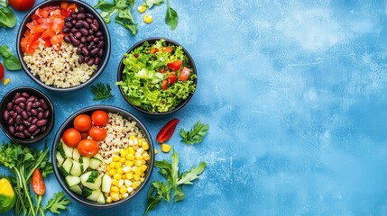 Fresh Colorful Salad Bowls with Quinoa and Vegetables on Blue Background