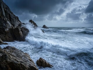 Powerful waves against rocky cliffs under a cloudy sky