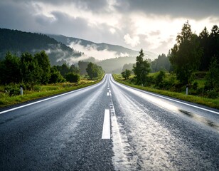 Fototapeta premium Winding road through lush green mountains after rain