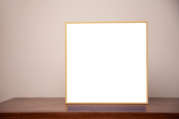A painting on a bench on a wooden table. Frame concept. Memory concept. 
Space for text.