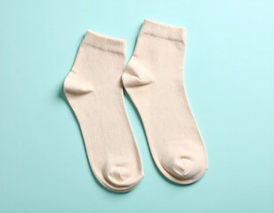 Pair of Beige Socks on Blue