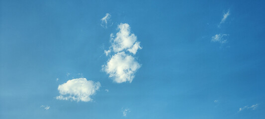 White cumulus clouds and blue sky cloudscape. Copy space.