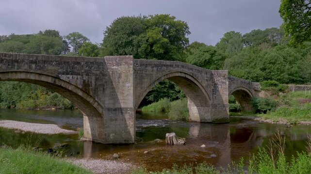 4k video of the picturesque 17th century Barden Bridge in North Yorkshire, UK