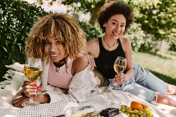 Enjoying a sunny summer picnic with best friends in a vibrant park setting
