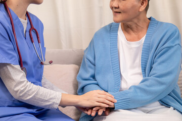 Obraz premium Caregiver in clinic consultation support, compassionate Nurse handhold senior patient at home shows trust communication, aging wellness journey, gentle touch reassures emotion, anxiety recovery
