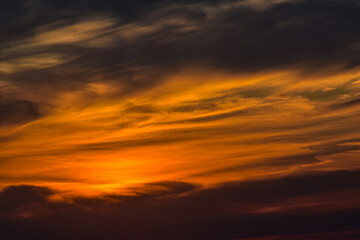 Dramatic sunset cloudscape in warm and neutral tones