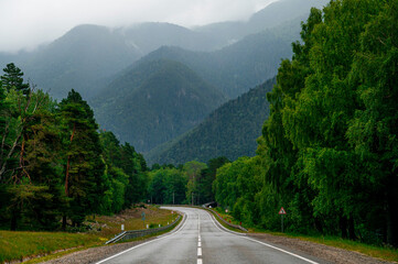 mountain road in the Caucasus to Arkhyz among the mountains in the clouds before rain