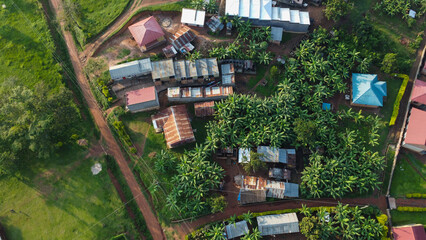 Aerial Panorama Captures Tropical Village Homes and Lush Greenery in a Rural Landscape