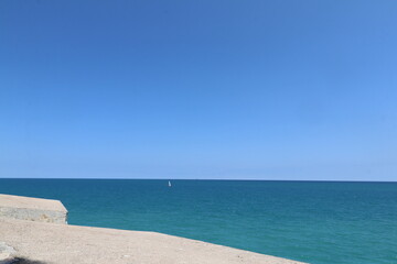Blue Mediterranean Sea contrasting with the light blue of the sky