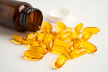 Fish oil or Cod liver oil gel in capsules with omega 3 vitamins, supplementary healthy food.