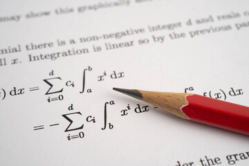 Pencil on mathematic formula exercise test paper in education school.