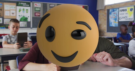 Holding tablet with smiley emoji teacher guiding students using tablets in classroom