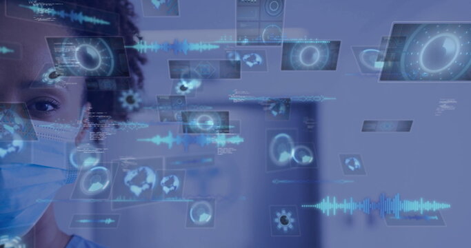 Masked nurse in scrubs using holographic panels with charts, code in hospital corridor, copy space