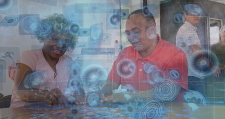 Arranging family members placing jigsaw puzzle pieces on wooden kitchen table, with digital overlay