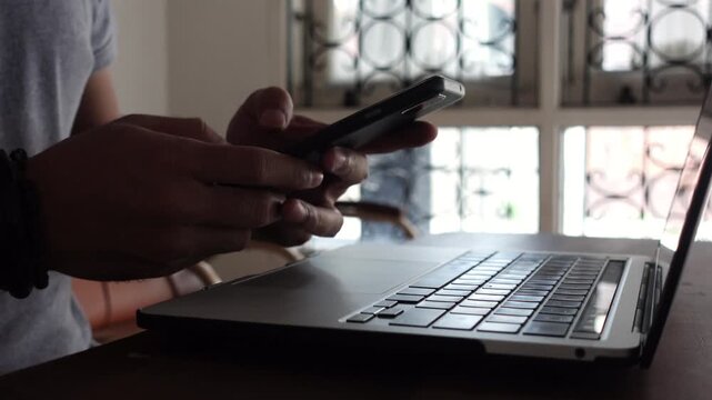 Cybersecurity 2FA login concept. A man logs in using a smartphone and laptop, showing remote work, online shopping, and digital activity.