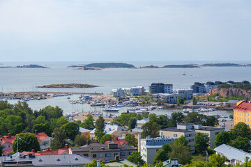 Aerial view of Hanko guest harbor, Finland, in summer, with sailboats and yachts docked along the...