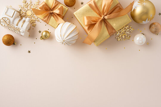Elegant flat-lay image featuring shimmering gold presents, ornaments, and festive decor for celebrations
