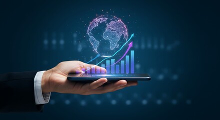 A businessman's hand holds a smartphone displaying a holographic globe and upward trending financial charts against a dark, tech-themed background.