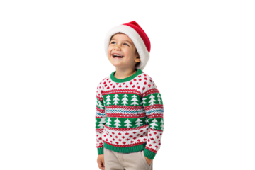 Young child in colorful Fair Isle Christmas sweater with Christmas trees and Santa hat, smiling joyfully, isolated on a transparent background