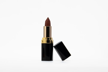 Elevate your beauty projects with this striking close-up of a luxurious, rich brown lipstick,...