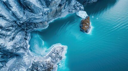 Aerial View of Turquoise Lake and Rugged Cliffs, Iceland.