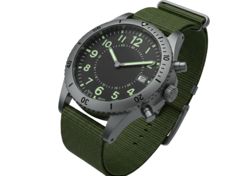 Isolated Military Style Wristwatch with Green Canvas Strap and Luminous Dial