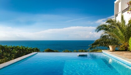 Obraz premium oceanfront infinity pool at luxury villa scenic seaside tranquility suitable for advertising hotels and luxury resorts travel agencies