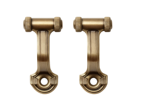 Two antique-style wall mounts, brass-colored, with a curved, arched design.  They feature a cylindrical section on each end, and a decorative, stylized arm extending between them