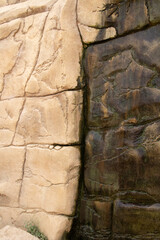 Sand stone wall ridged textured gritty yellow wet dry background