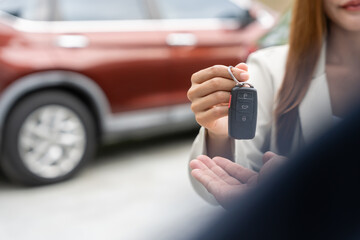 Fototapeta premium Used car, rental car, sell, buy. happy pass on key for new owner. Sales, loan credit financial, rent vehicle, insurance, renting, Seller, dealer, installment, car care business