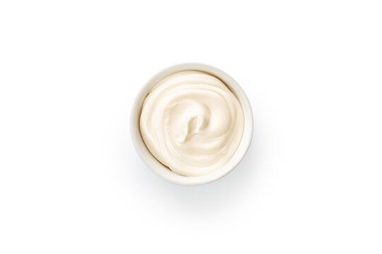 Mayonnaise, mayo, white cream sauce in a white little bowl, gravy boat isolated on white background with clipping path, cut out.