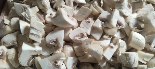 Close up shot of sliced raw mushrooms.