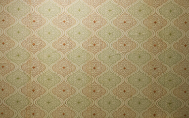 Old wallpaper on the wall. Old wallpaper for texture or background.