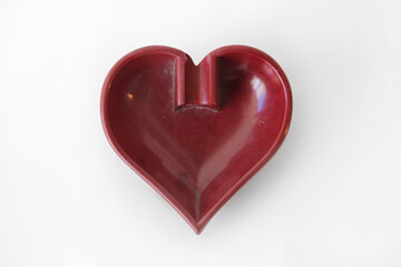 Heart shaped ashtray isolated on a white background, close-up