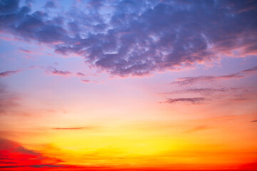 Sky,Beautiful sunset view, luxury soft gradient orange gold clouds and sunlight on the blue dramatic sky perfect for the background, morning, evening,Twilight, climate change,horizontal sunset photo