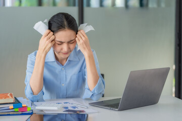 Financial problems. Sad depressed young woman looking at bills managing monthly household budget.