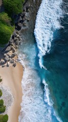 Aerial Drone Image of Coastal Beach with Offshore Coral, Rocky Shoreline, and Vibrant Ocean Waves