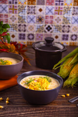 Delicious creamy corn soup in a bowl. Autumn food. Harvest concept