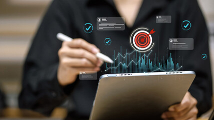 Businessman Analyzing Target Metrics with Digital Pen on Tablet