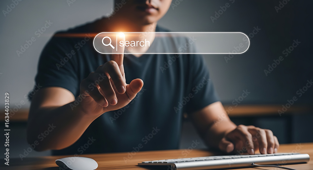 Poster closeup of a mans finger touching a search bar on a digital interface, representing online searching