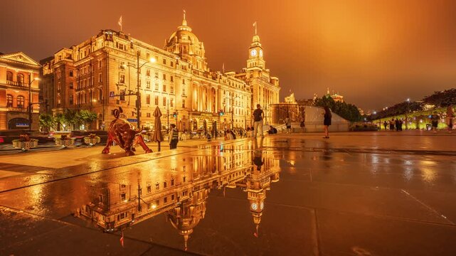 The Bund Bull and historic buildings at night in Shanghai