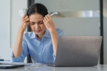 Financial problems. Sad, depressed young woman looking at bills, managing a monthly household...